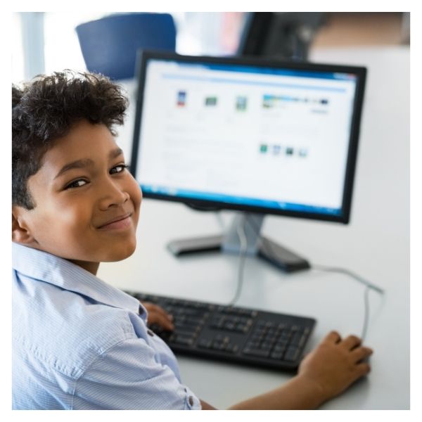 child at computer in school